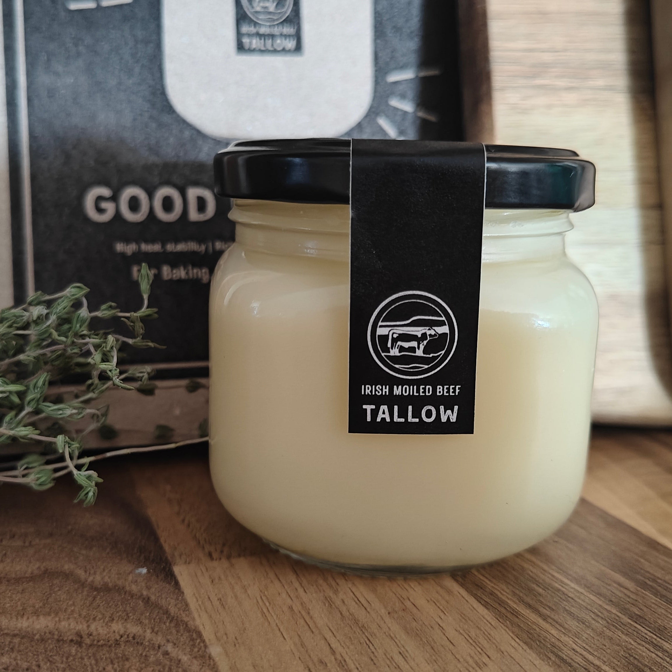 Jar of tallow with a label on a wooden surface