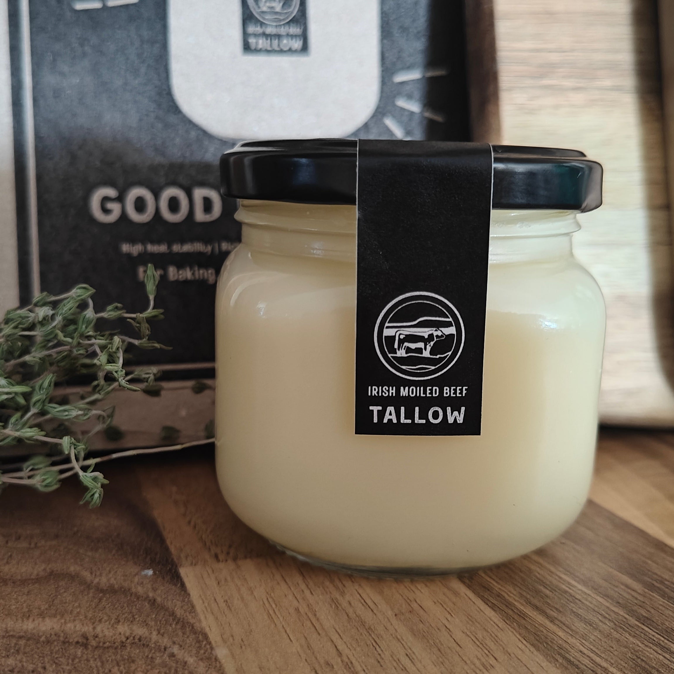 Jar of tallow with a label on a wooden surface