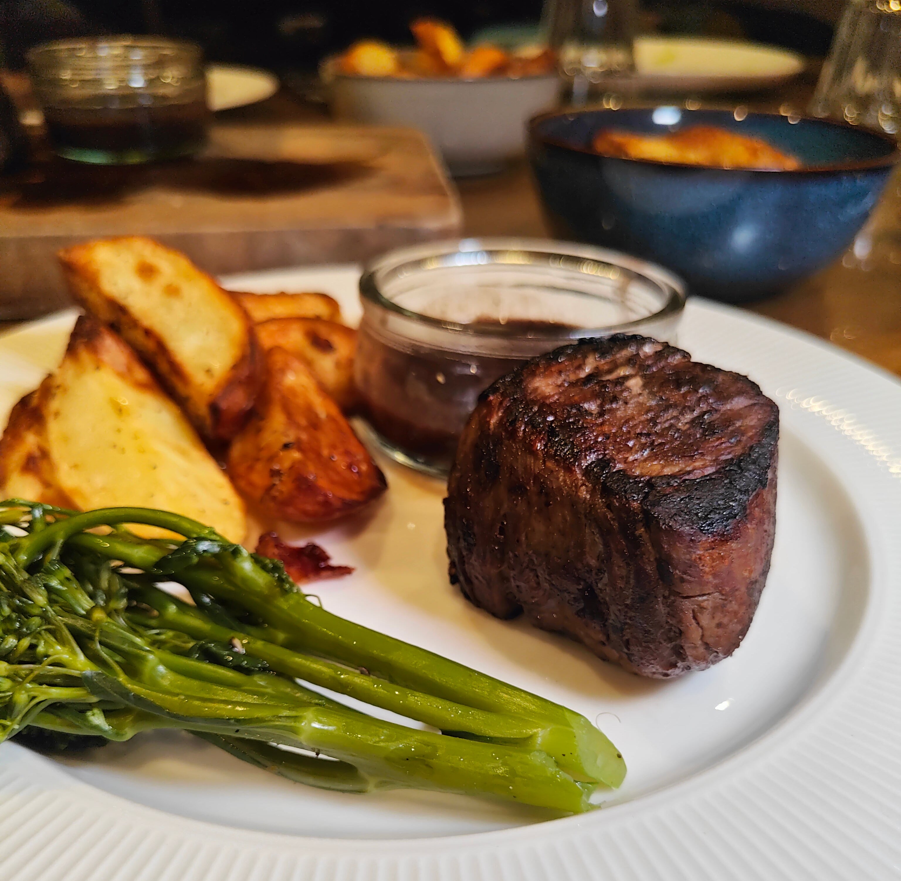 Irish Moiled Fillet Steak on a white plate with tallow chips and tender-stem broccoli.