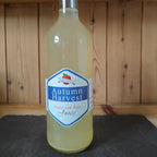 Bottle of 'Autumn Harvest' apple and pear juice on a wooden shelf.