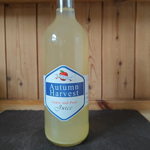Bottle of 'Autumn Harvest' apple and pear juice on a wooden shelf.
