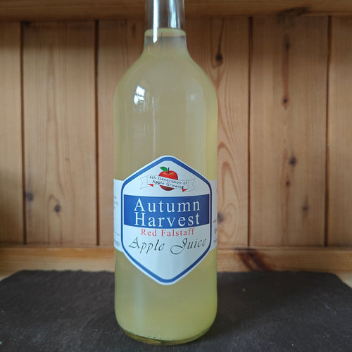 Bottle of Autumn Harvest Apple Juice on a wooden shelf