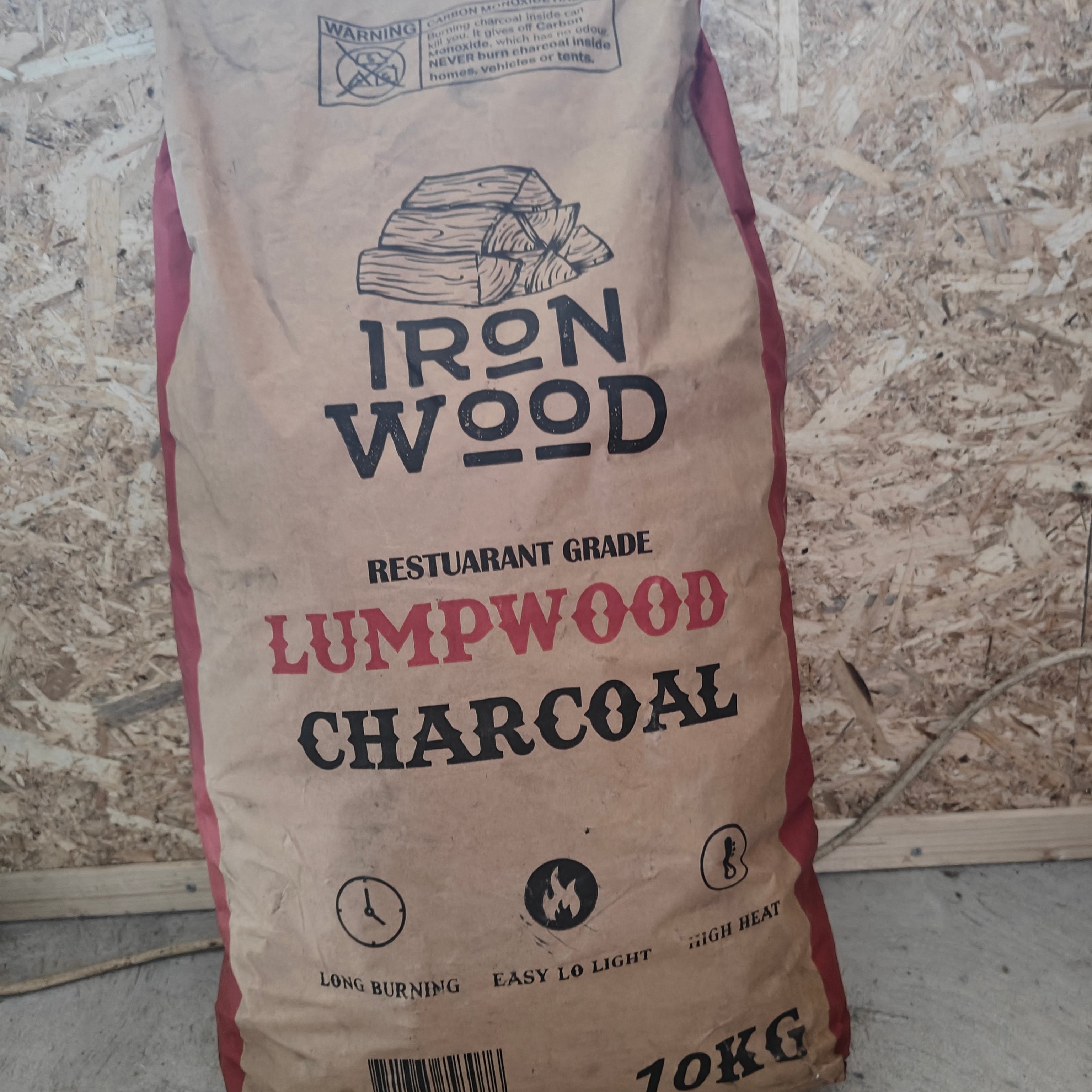 Bag of Iron Wood lumpwood charcoal on a stone surface