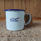 White mug with blue rim and Falcon Housewares logo on a textured surface.